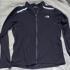 Black zip up north face jacket
